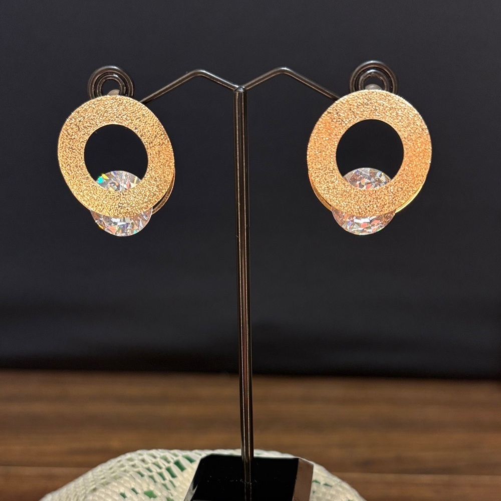 Elegant Gold Tone Circle Earrings with Crystal Detail